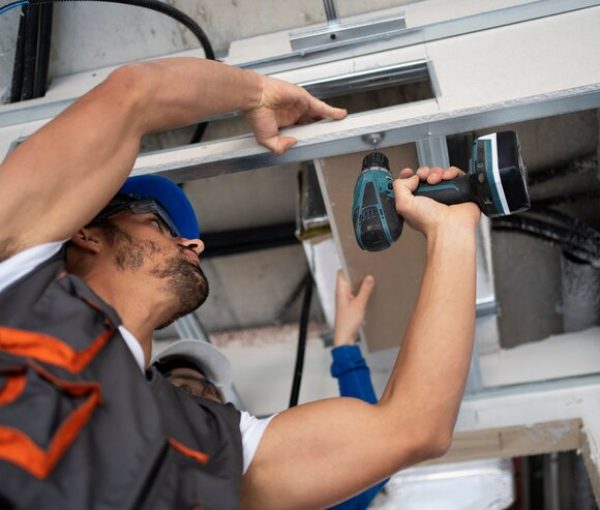 low-angle-people-working-with-drill_23-2149366670 low-angle-people-working-with-drill_23-2149366670