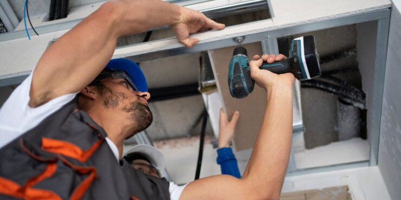 low-angle-people-working-with-drill_23-2149366670 low-angle-people-working-with-drill_23-2149366670